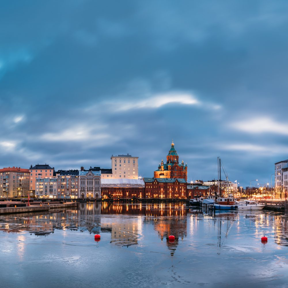 Helsinki, Finland. Panoramic View Of Pier, Embankment On Kanavaranta Street, Uspenski Cathedral And Pohjoisranta Street In Evening Illuminations.